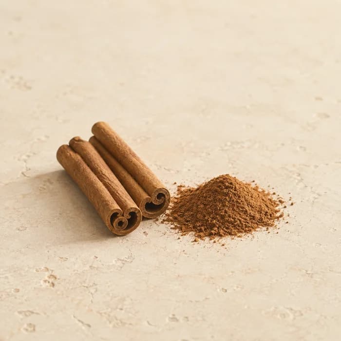 Cinnamon quills beside ground cinnamon